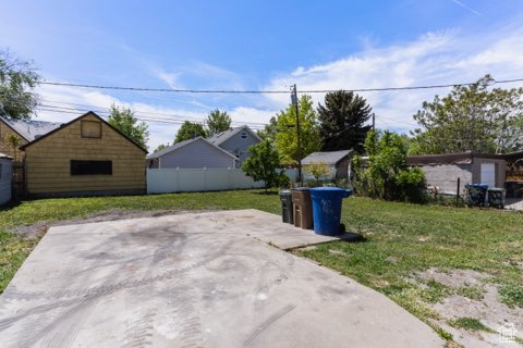 View of patio with an outbuilding