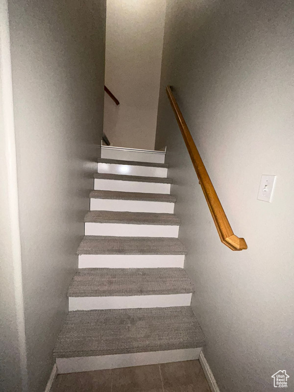 Stairway featuring baseboards