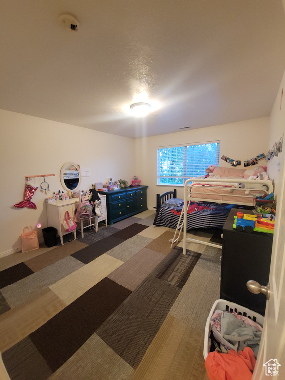 Bedroom with carpet flooring