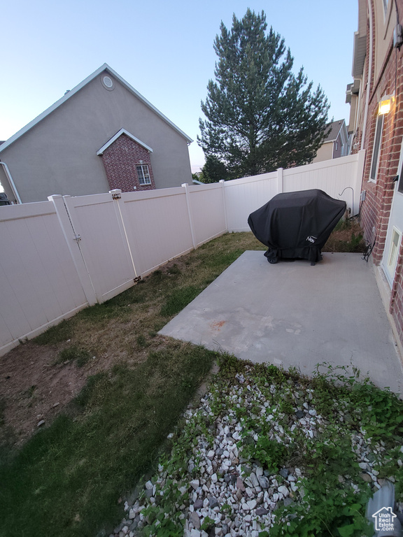 Fenced backyard with a patio area