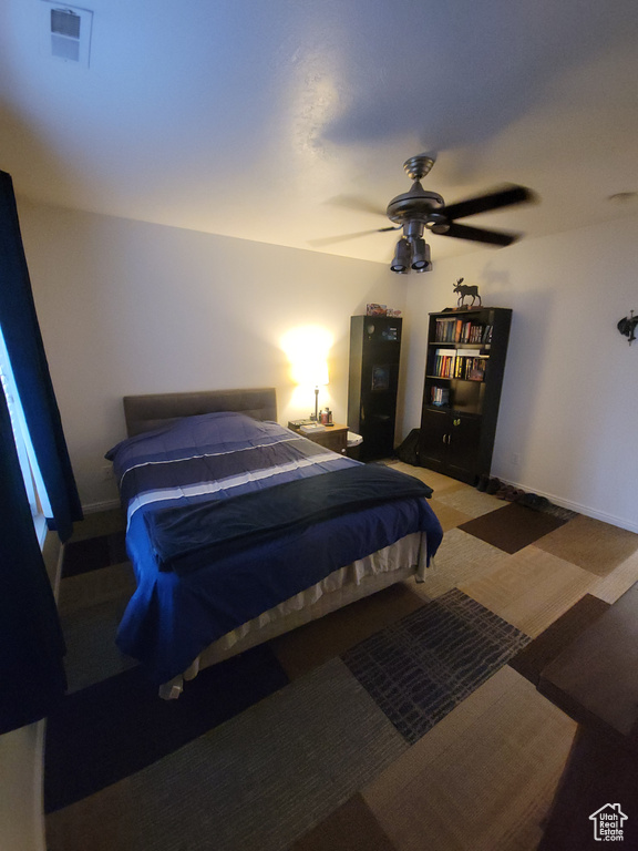 Bedroom featuring a ceiling fan