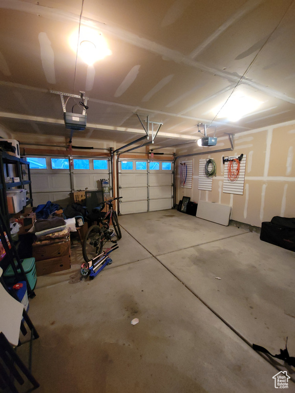 Garage featuring a garage door opener