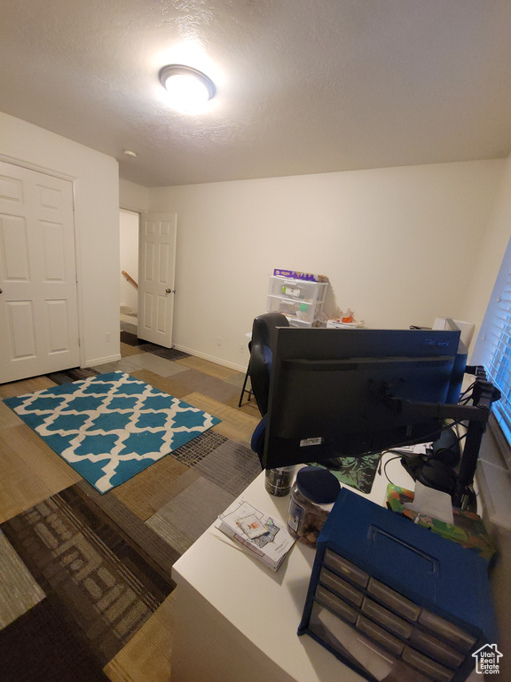 Office area featuring baseboards