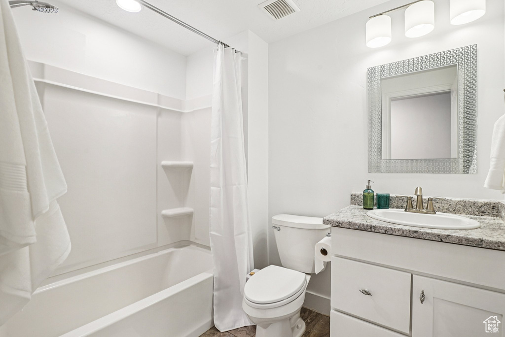 Full bathroom with vanity and shower / bath combo