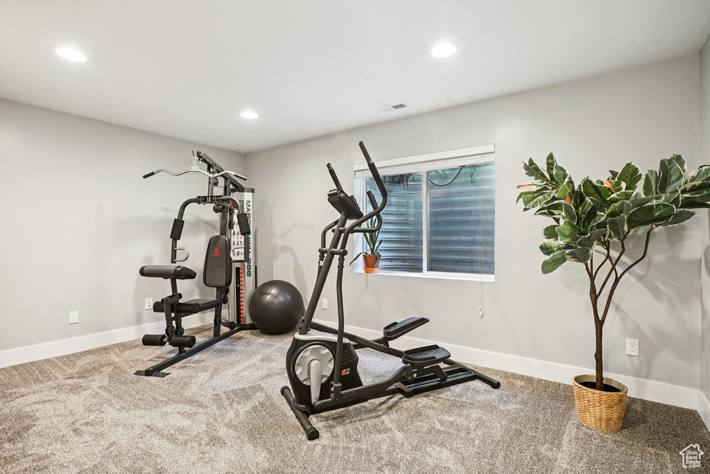 Exercise area featuring carpet and recessed lighting