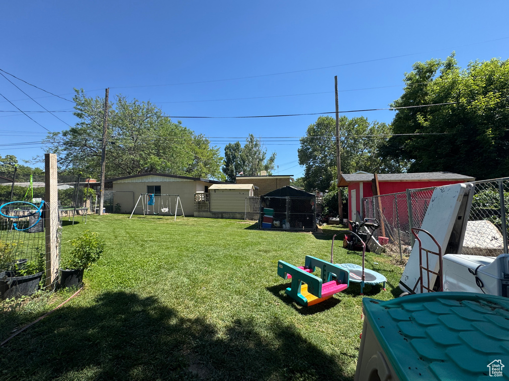 View of yard featuring a playground