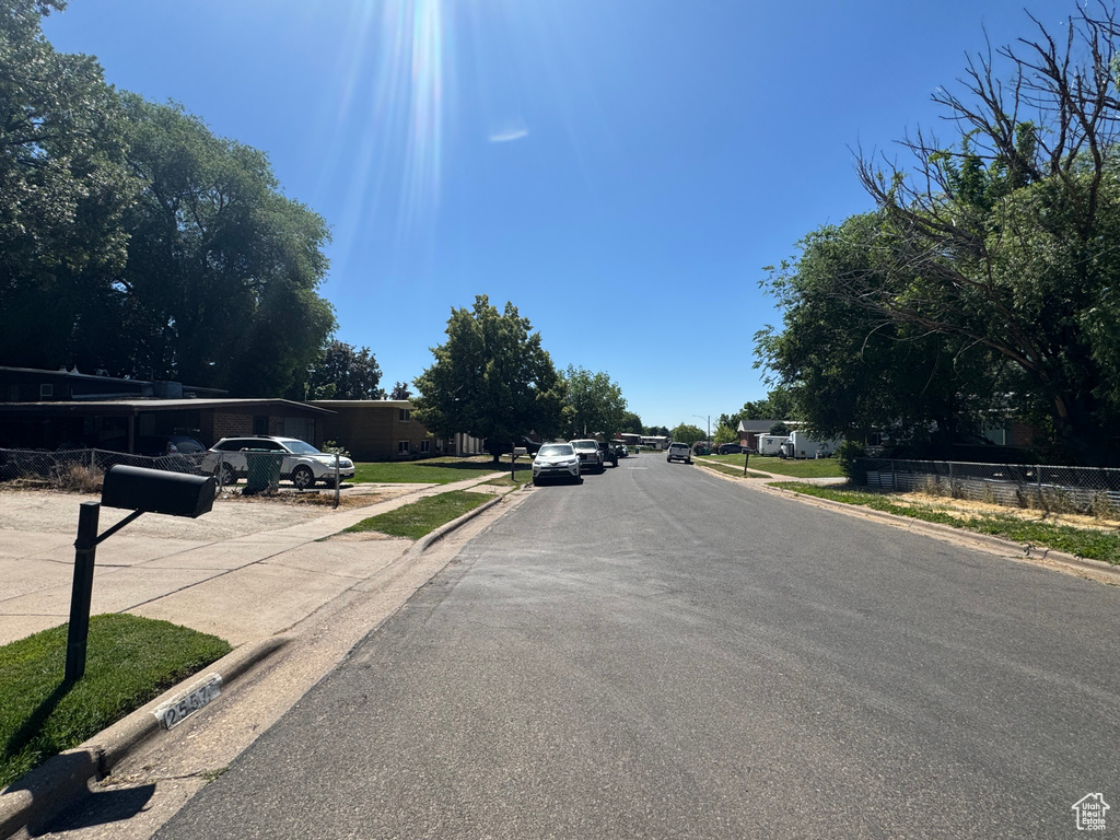 View of asphalt street with curbs and sidewalks
