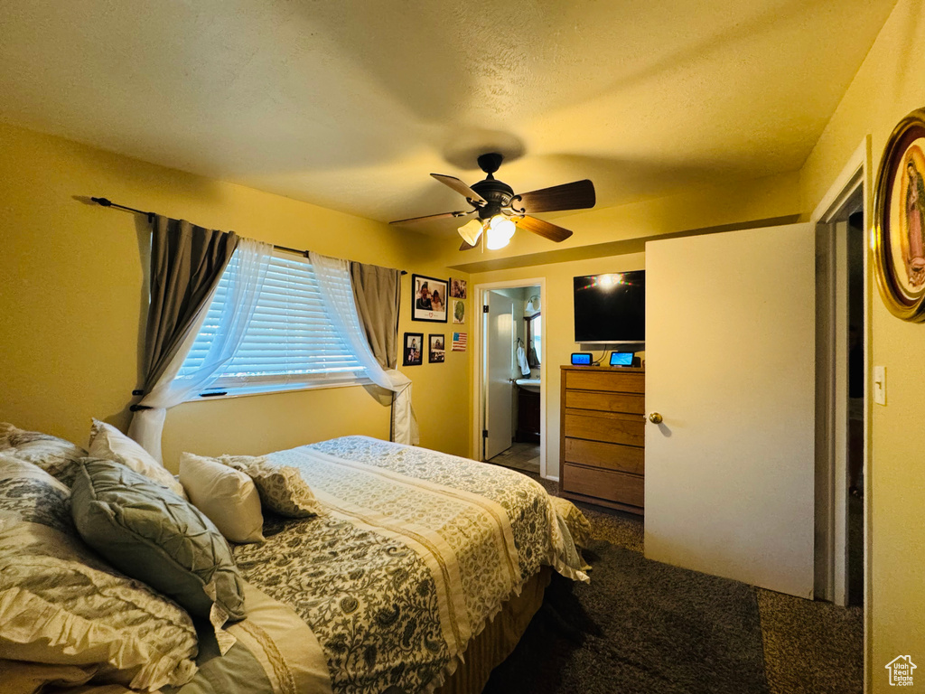 Bedroom with carpet and a ceiling fan