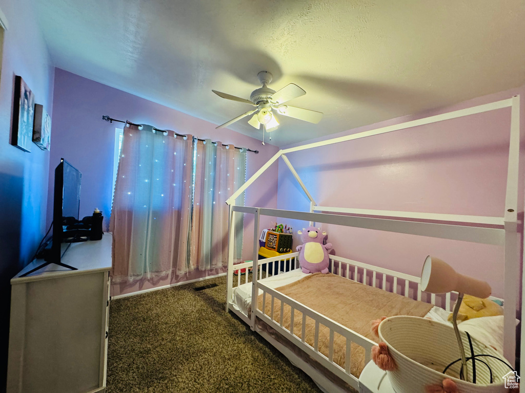 Bedroom with carpet and a ceiling fan