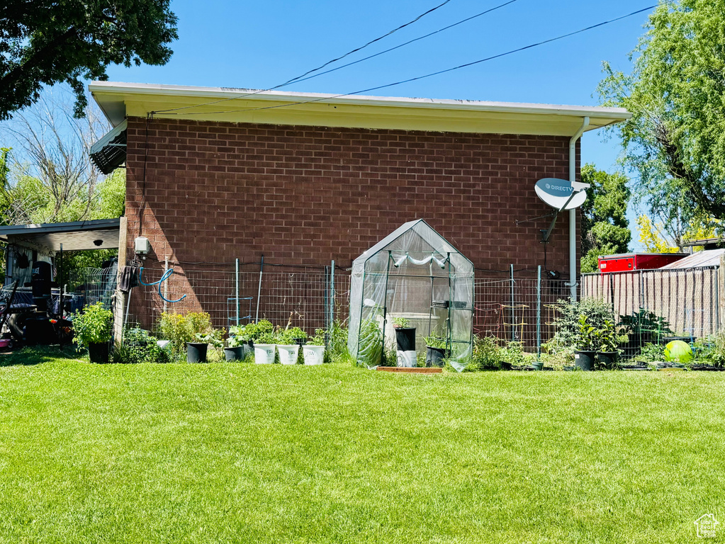 View of side of home featuring brick siding