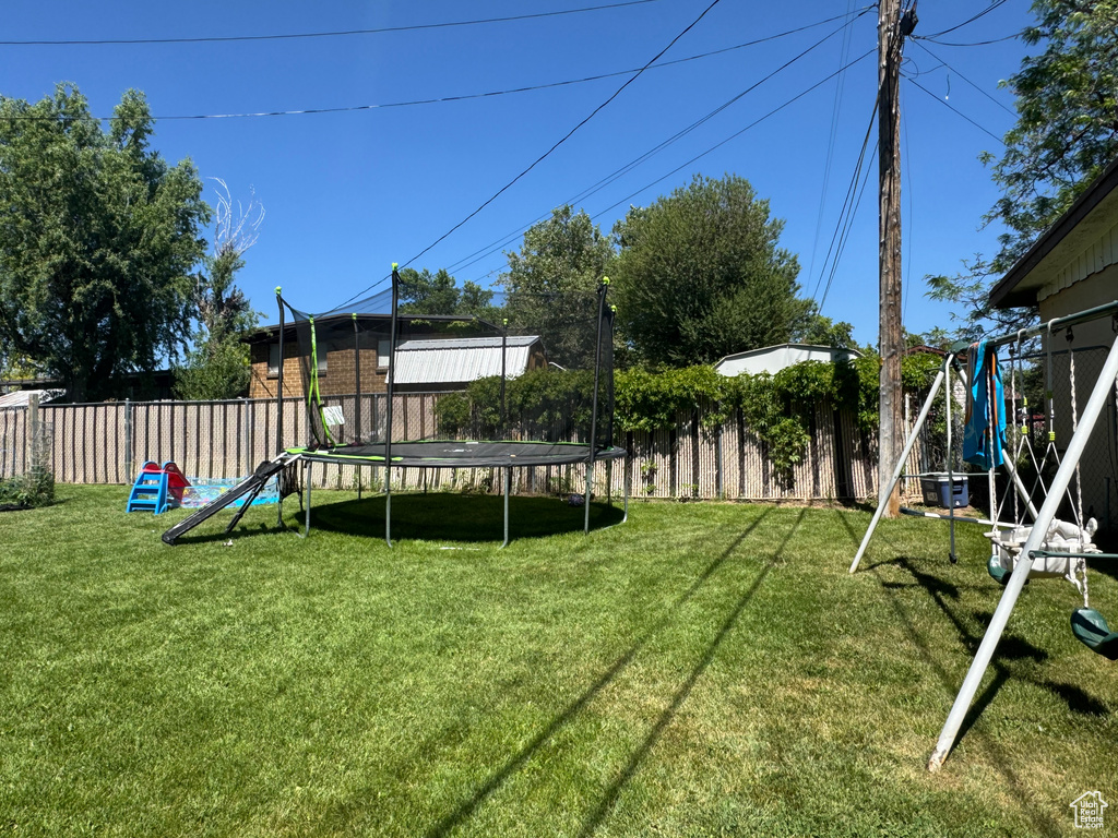 View of yard with a trampoline