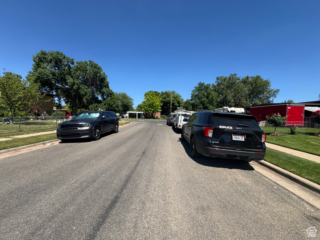 View of asphalt street with sidewalks and curbs