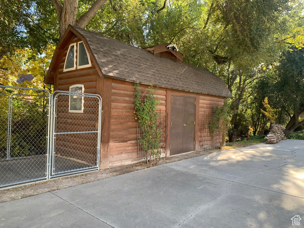 View of outdoor structure with a gate
