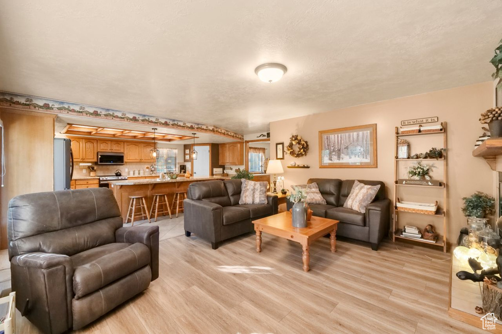 Living area featuring light wood-type flooring