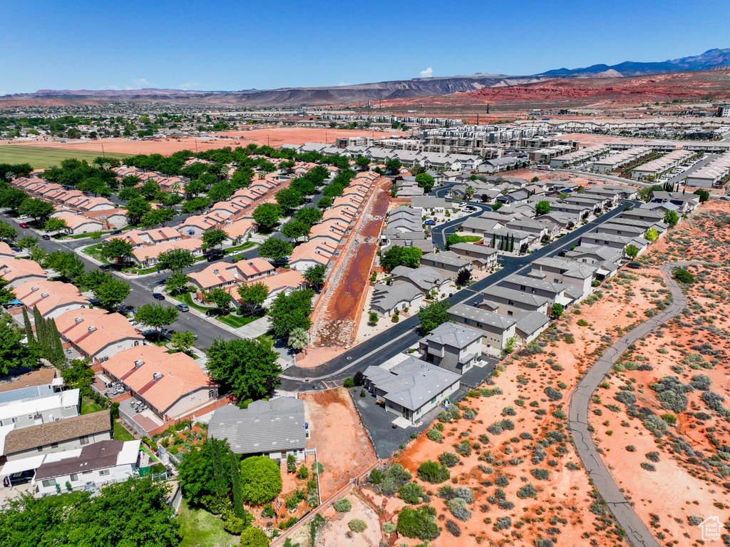 Aerial view of property\'s location featuring mountains and nearby suburban area