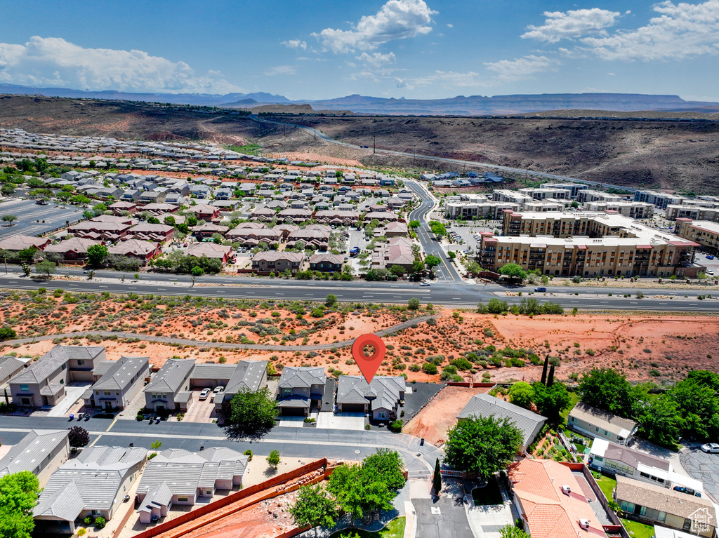 Aerial perspective of suburban area with a mountainous background