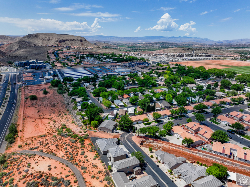 Aerial perspective of suburban area featuring a mountainous background