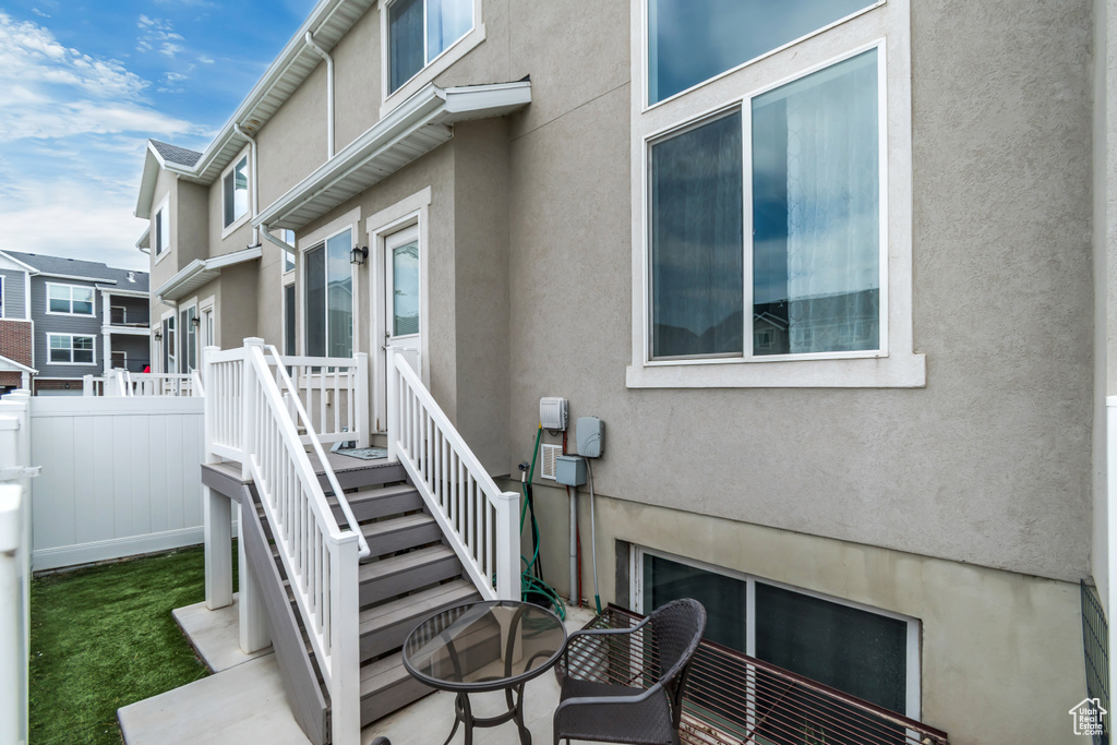 Doorway to property with stucco siding