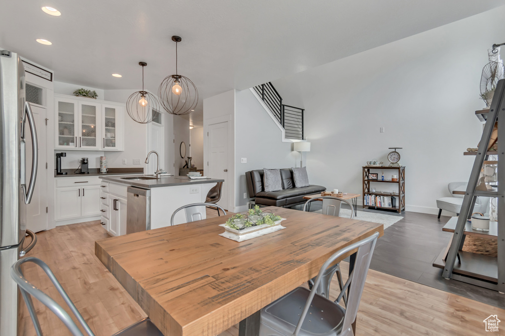 Dining space featuring light wood finished floors and recessed lighting