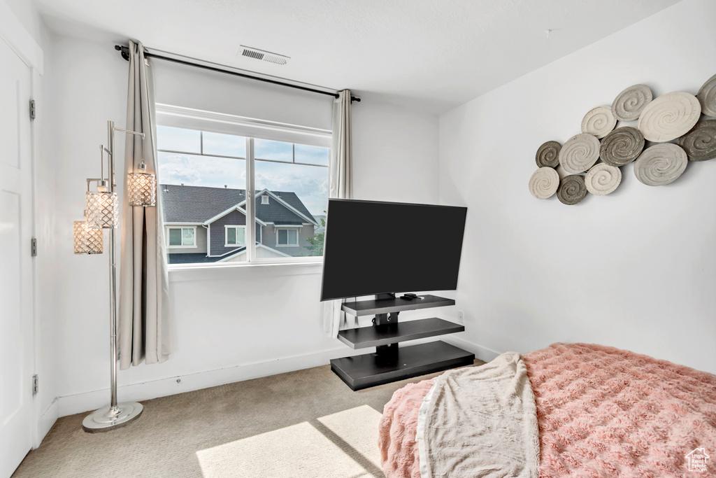 Carpeted bedroom with baseboards