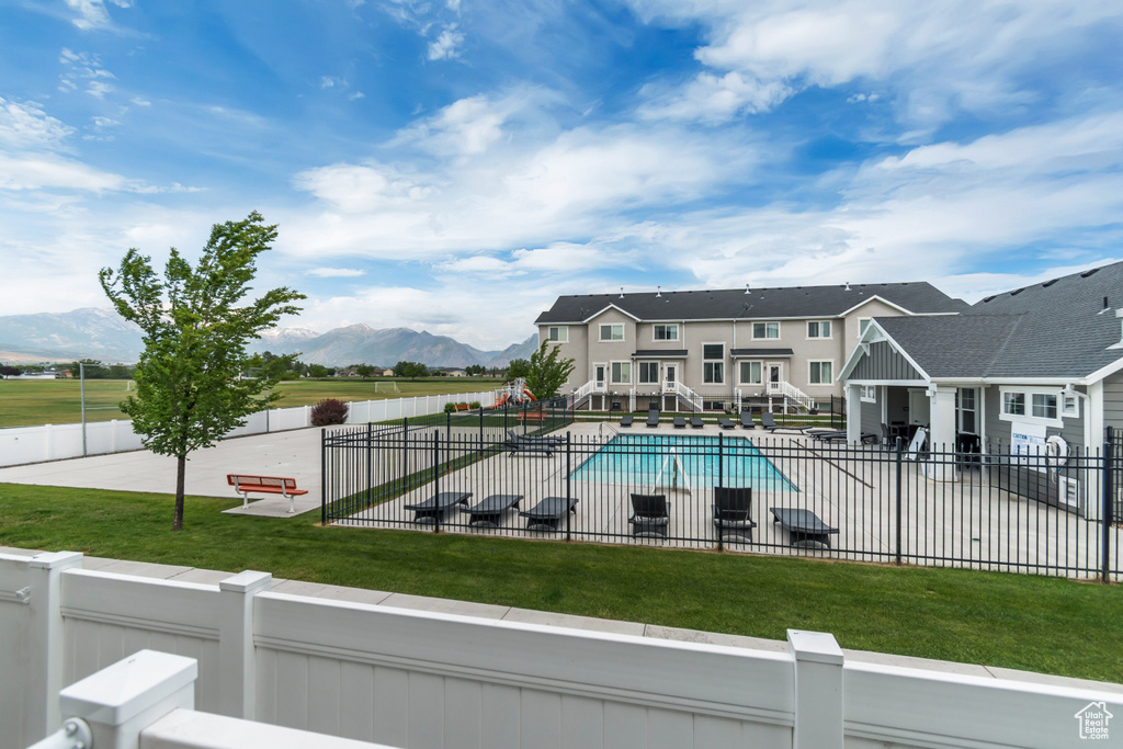 View of pool with a mountain view
