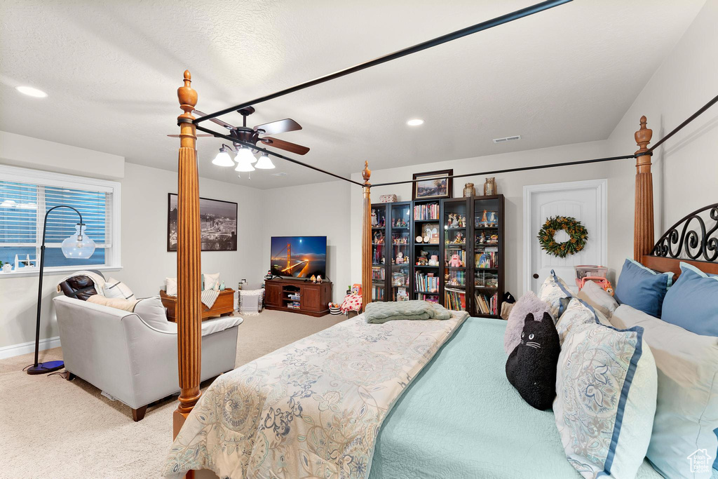 Carpeted bedroom featuring recessed lighting, a ceiling fan, and baseboards
