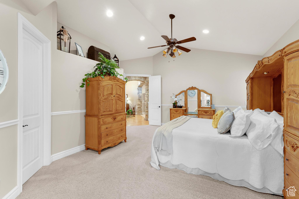 Bedroom featuring lofted ceiling, light colored carpet, baseboards, ceiling fan, and recessed lighting