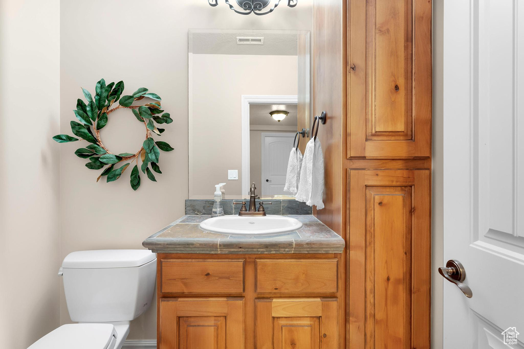 Half bath with toilet and vanity