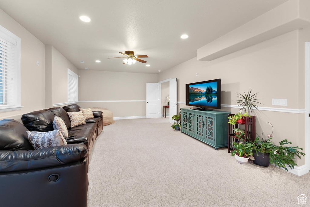Living room featuring carpet floors, ceiling fan, recessed lighting, and baseboards