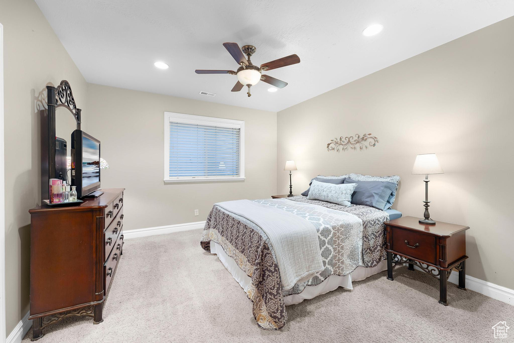 Bedroom with baseboards, light colored carpet, recessed lighting, and a ceiling fan
