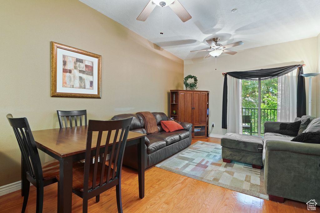 Dining area with ceiling fan, wood finished floors, and baseboards