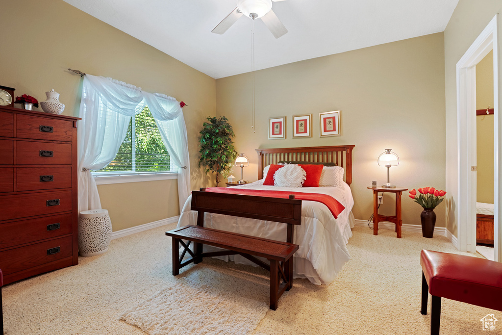 Bedroom featuring carpet flooring, baseboards, and ceiling fan