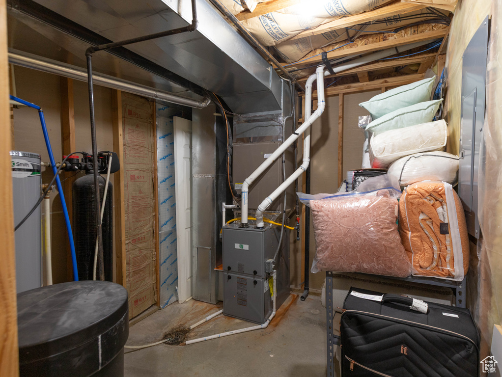 Utility room featuring heating unit