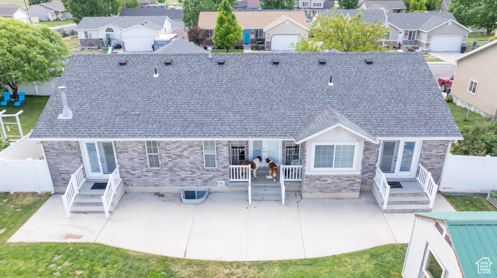 Back of property featuring french doors, a patio, and a fenced backyard