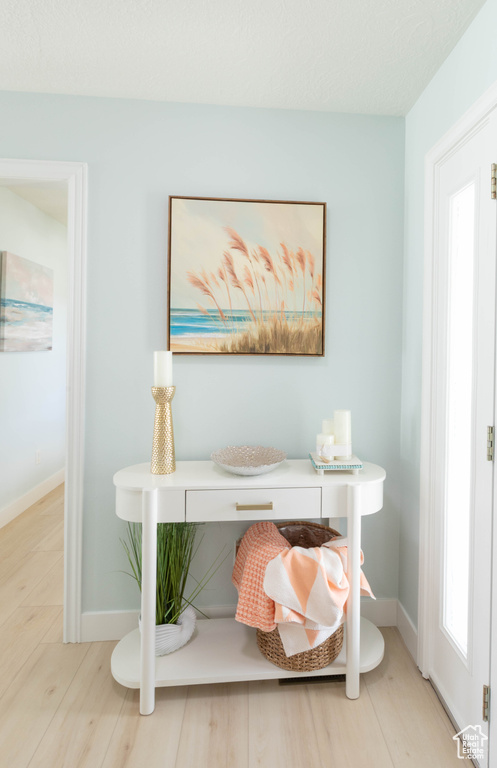 Detailed view of baseboards and wood finished floors