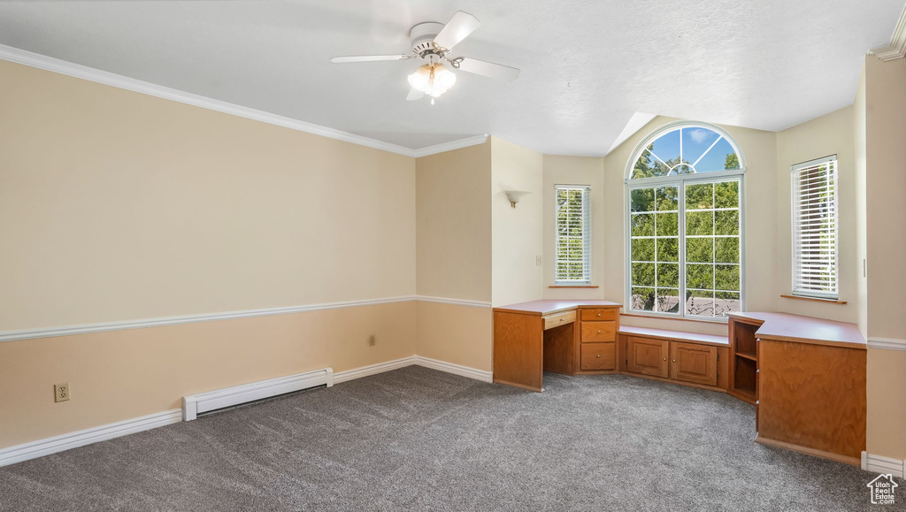 Unfurnished office with baseboard heating, a ceiling fan, carpet flooring, baseboards, and built in study area