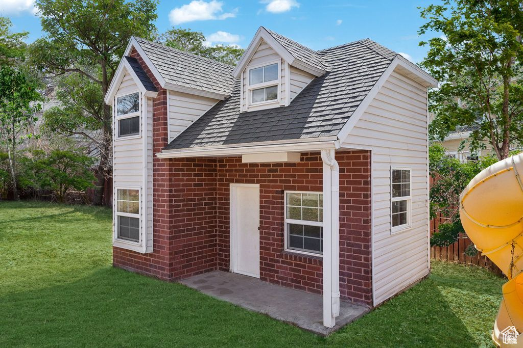 Back of property with brick siding