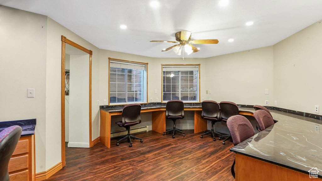 Office area with a baseboard radiator, dark wood-style floors, a ceiling fan, built in study area, and recessed lighting