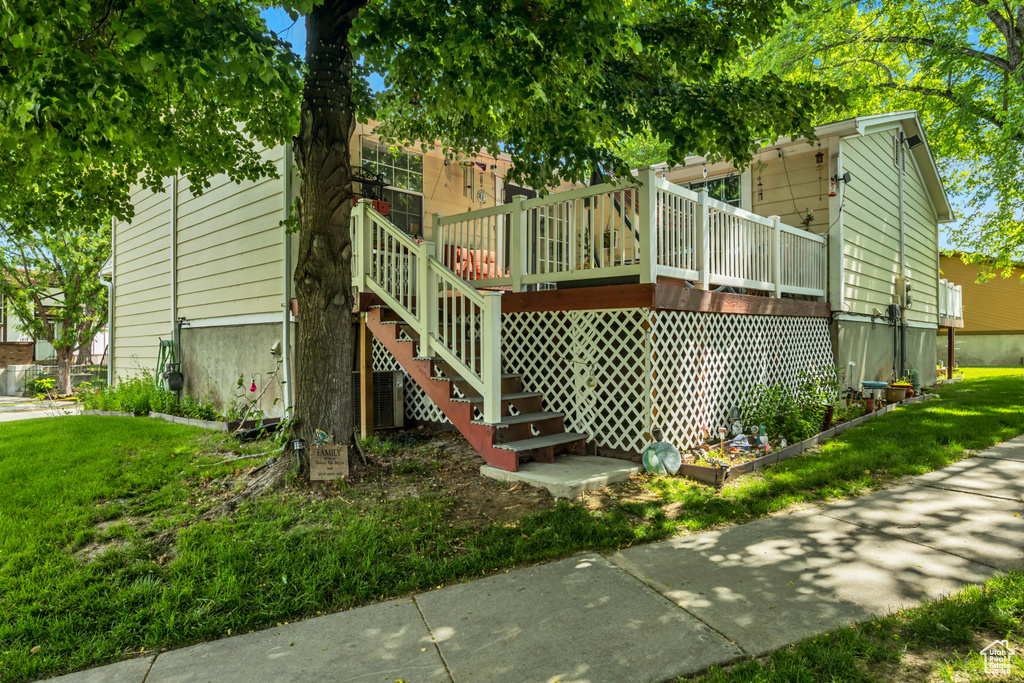Exterior space with a lawn and stairs