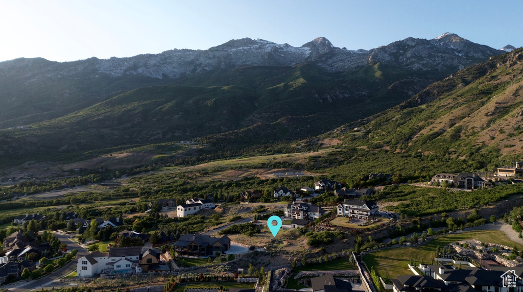 View of mountain backdrop featuring nearby suburban area