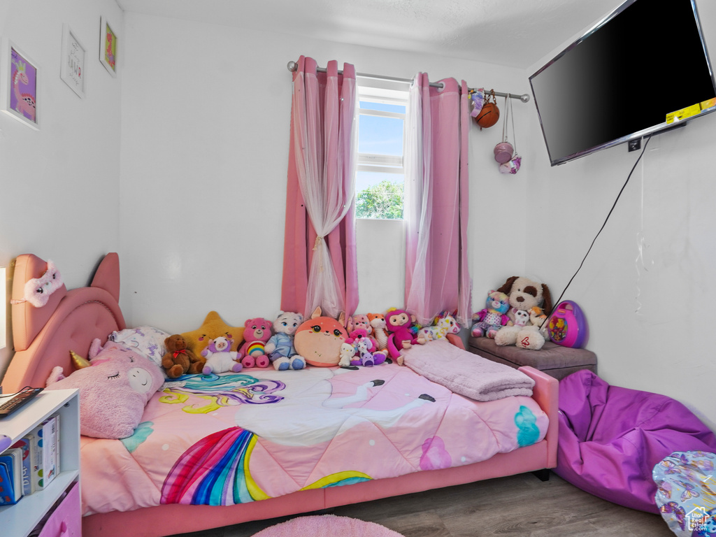 Bedroom with wood finished floors