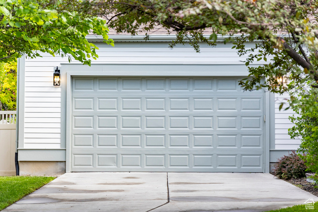 Garage featuring driveway