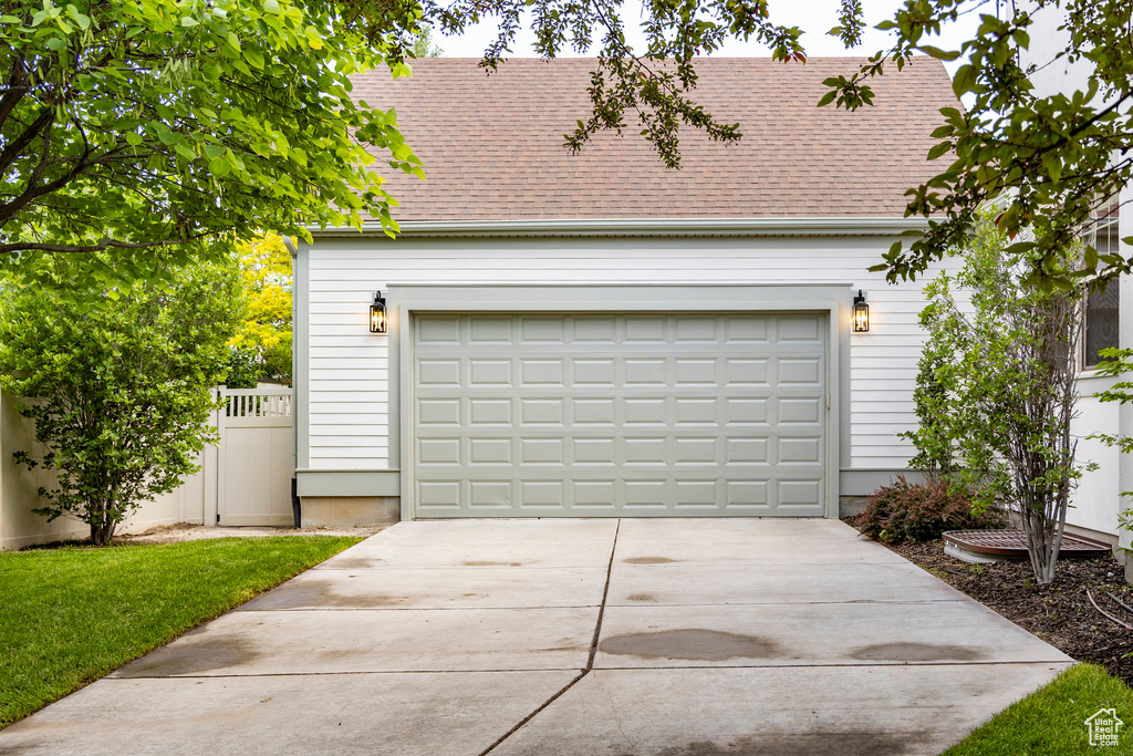 Garage with concrete driveway