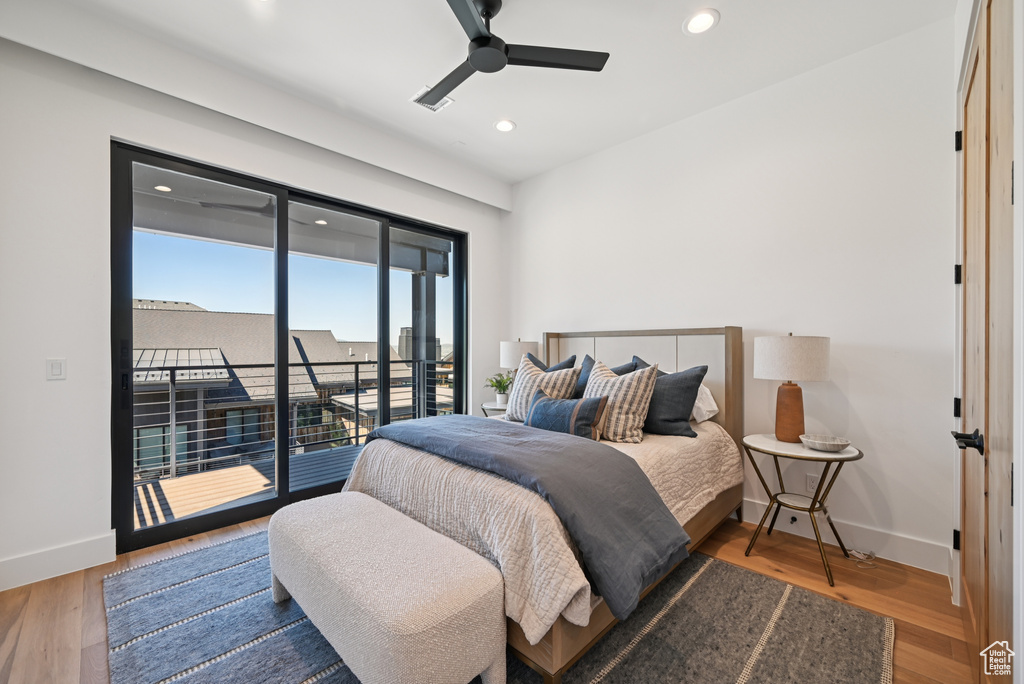 Bedroom with access to outside, baseboards, recessed lighting, wood finished floors, and ceiling fan