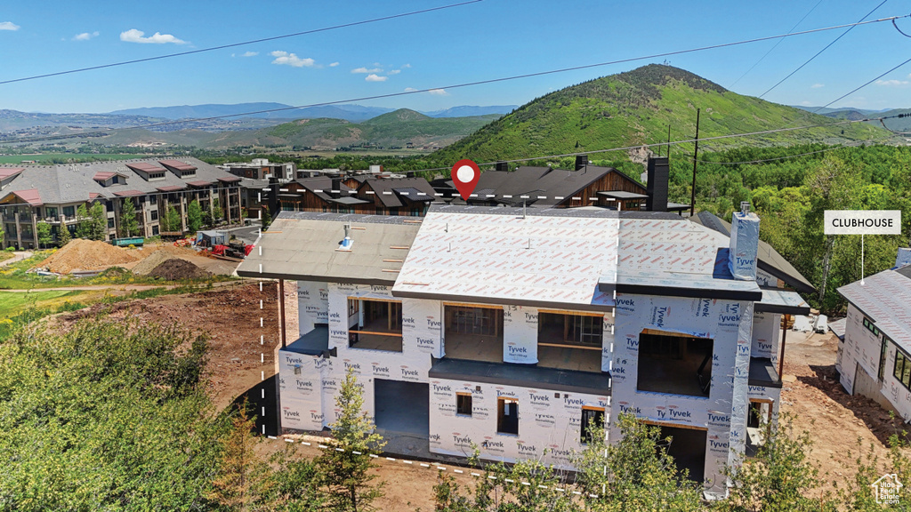 View of front of property featuring a mountain view and a chimney