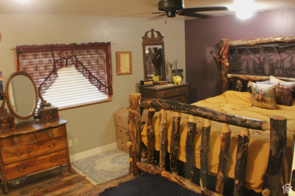 Bedroom with wood finished floors and ceiling fan