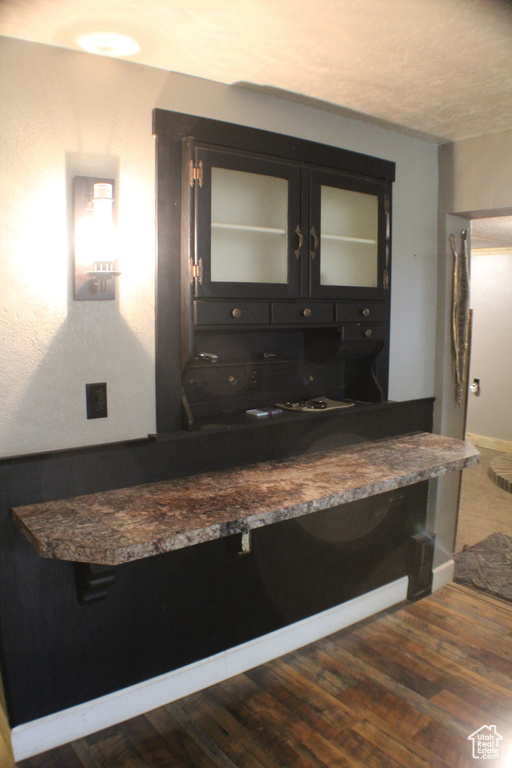 Detailed view of wood finished floors and baseboards