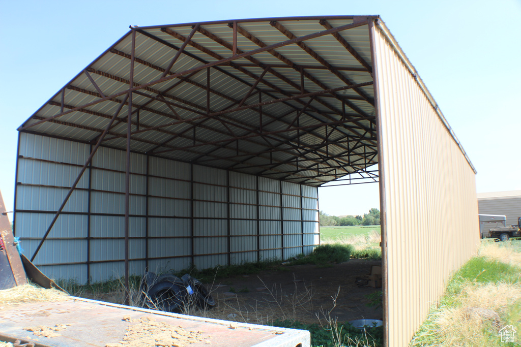 View of outbuilding featuring a carport