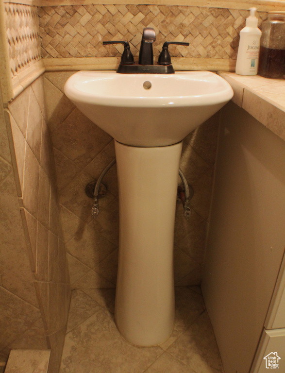 Bathroom with a sink and tile patterned floors