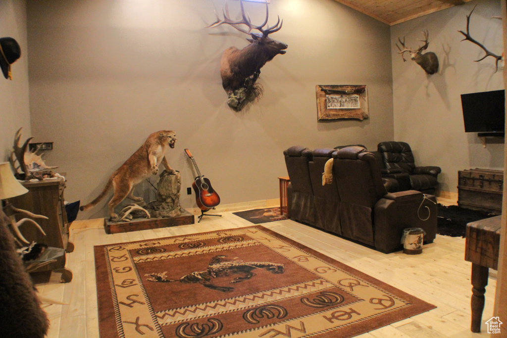 Home theater featuring wood finished floors